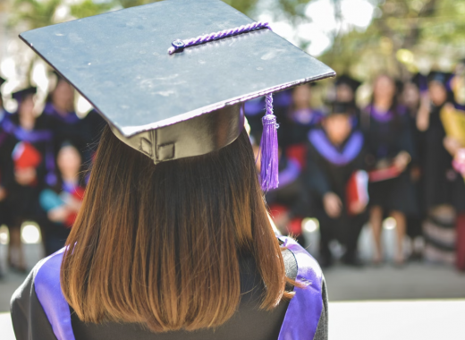 Woman Wearing a Cap and Gown for Graduation